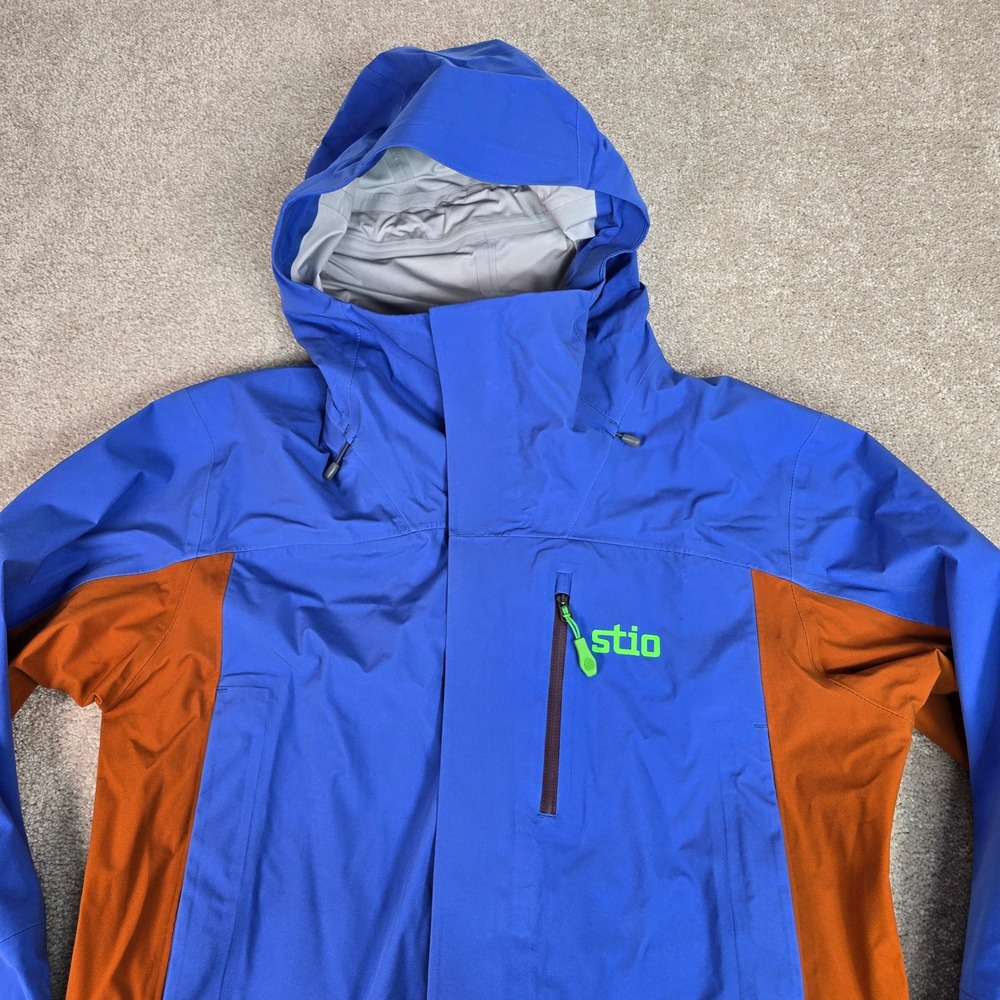 Stio Unisex Raymer Hardshell Jacket Larkspur Blue‎ Saddle XS 400137-449-XS NEW